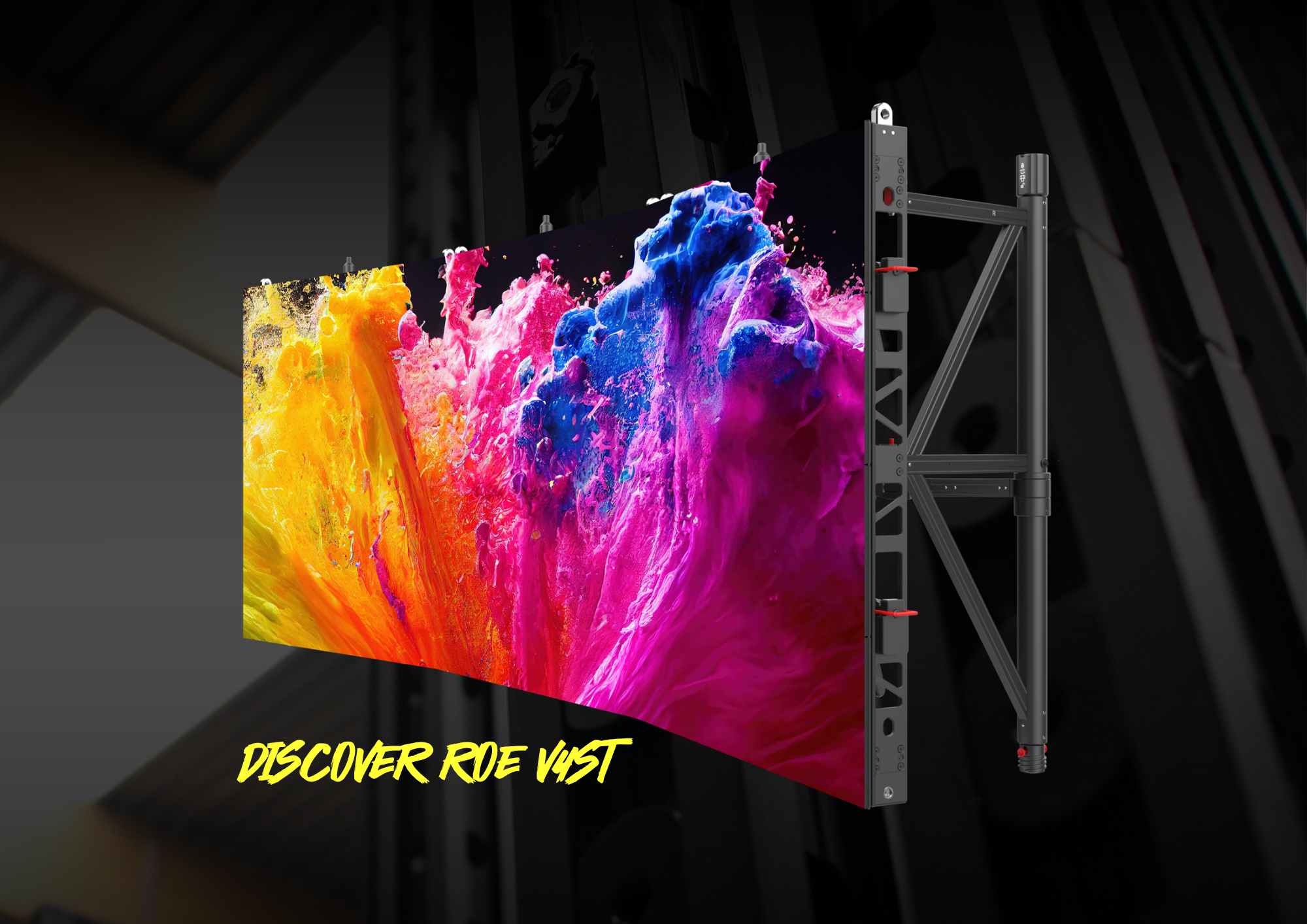 A curved ROE V4ST LED display panel mounted on a rear support frame, shown from an angled side view, displaying a vibrant abstract design with yellow, orange, pink, purple and blue paint-like splashes. The text "DISCOVER ROE V4ST" appears in bold yellow lettering at the bottom against a dark industrial background.