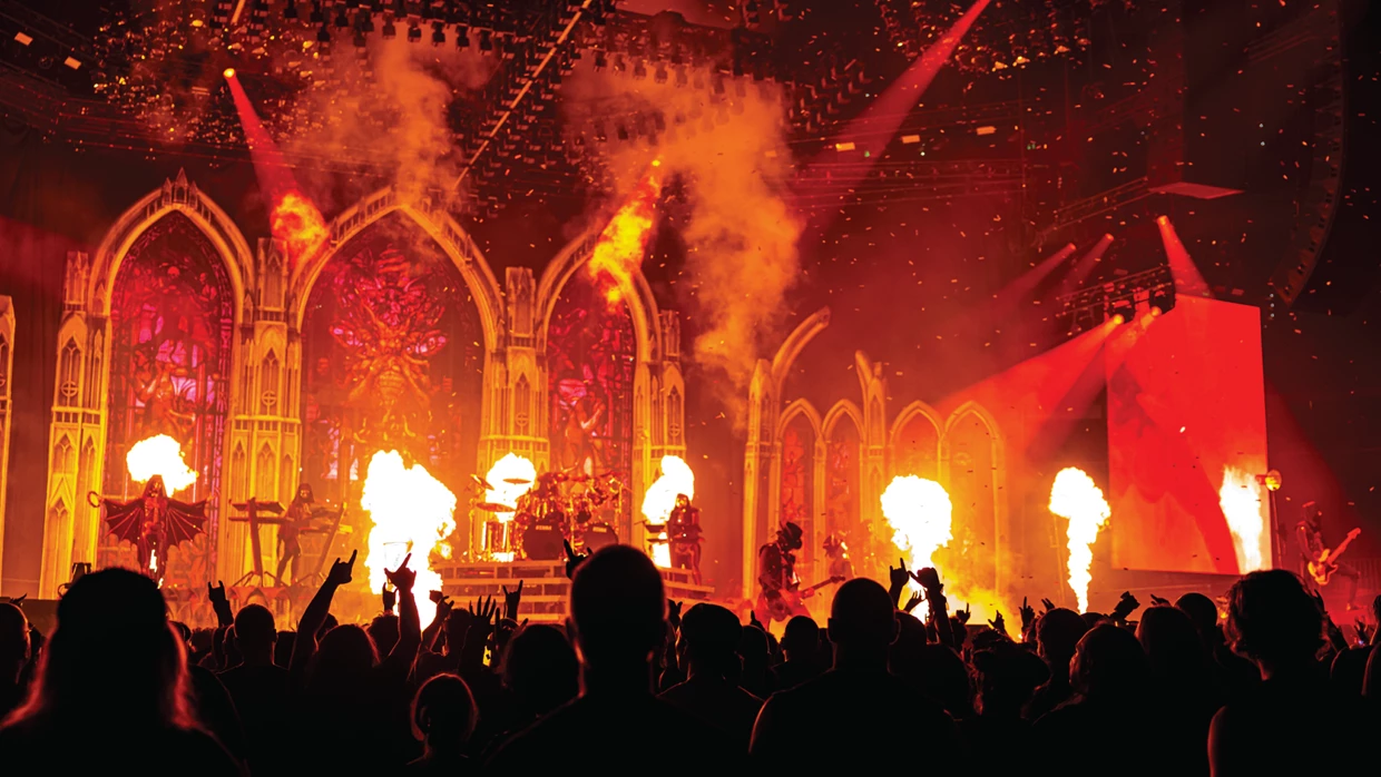 Ghost's production is theatrical and dense transforming arenas into a shadowy cathedral of light and sound.